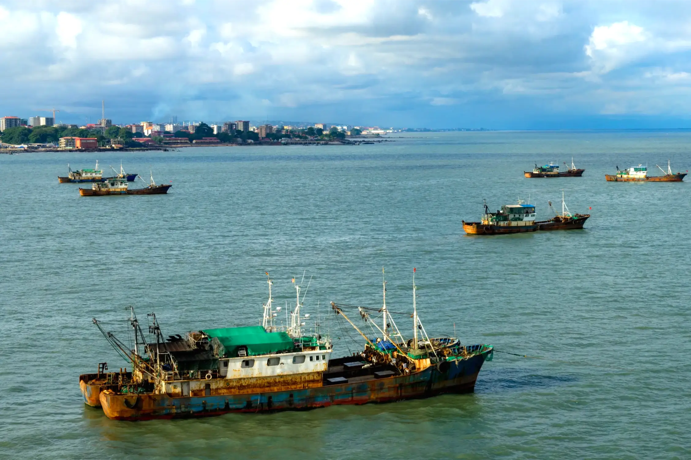 old rusty fishing boat in conakry guinea
