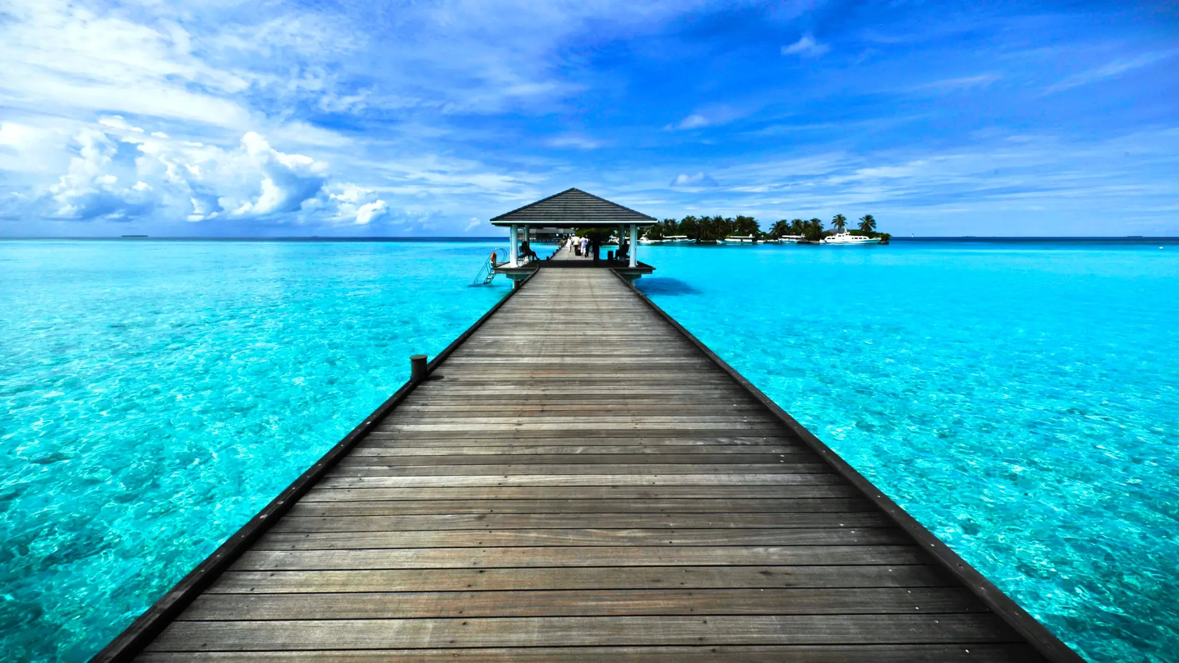 wooden walkway on the sea in the maldives